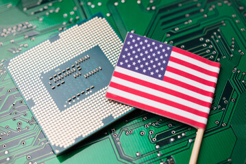 CPU computer (central processing unit) US flag on circuit board background. US vs China chip war or...