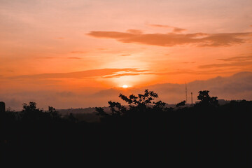 Sunset Sky clouds over Horizon sea landscape in the Evening Summer season Background, Dramatic Colorful Orange, Yellow sunlight fluffy after sundown on Twilight, Dusk sky backgrounds