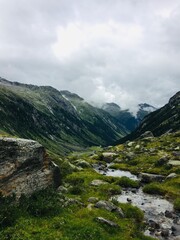 Hiking in Austrian Alps. Foggy day.