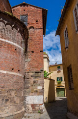 Lucca beautiful medieval historical center alley with St Giulia Church apse
