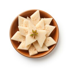 Kaju katli on a plate top view isolated on white background