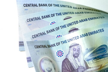 Fototapeta premium Close up Dirhams currency with new design Notes, AED, Bank notes and coins, United Arab Emirates