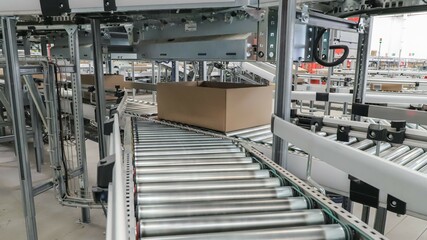 packing line in a logistics warehouse. conveyor belt in a modern production line