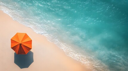 Serene Aerial View of Orange Beach Umbrella on Tranquil Summer Coastline