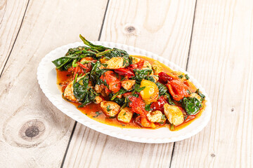 Chicken with tomato and spinach