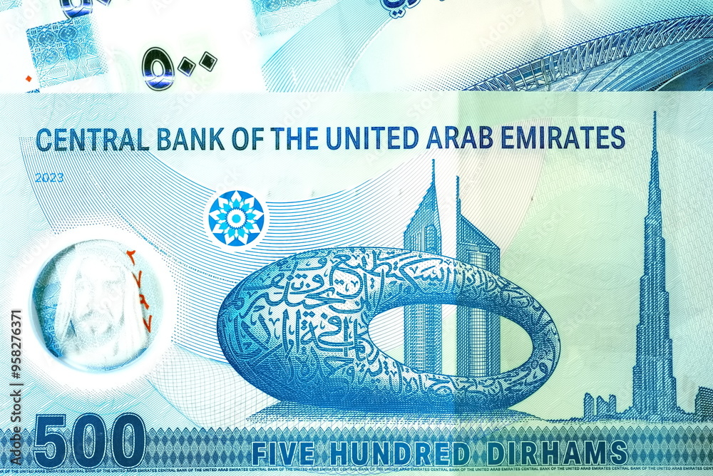 Wall mural close up dirhams currency with new design notes, aed, bank notes and coins, united arab emirates