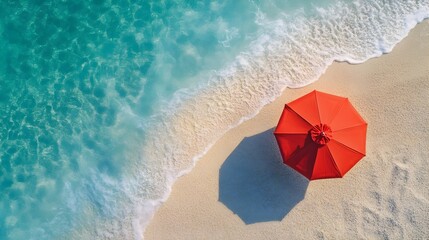 Naklejka premium Aerial View of a Sun Umbrella on a Stunning Summer Beach with Turquoise Waters