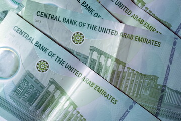 Fototapeta premium Close up Dirhams currency with new design Notes, AED, Bank notes and coins, United Arab Emirates