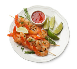 Skewers with delicious grilled shrimps, lime and sauce isolated on white, top view