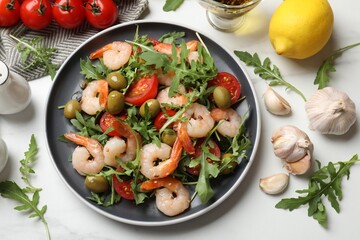 Delicious shrimp salad and ingredients on white table, flat lay