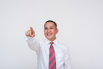 Friendly middle aged office male professional spotting a friend from afar, pointing with his finger. Set against a white background.