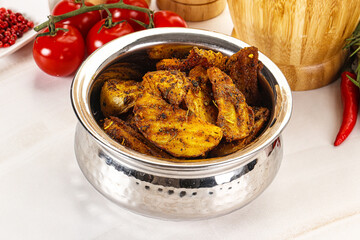 Golden baked potato Idaho with spices