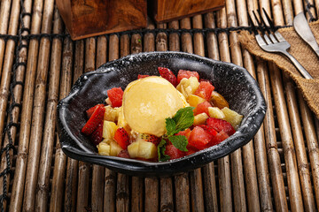 Sweet fruit salad with ice cream