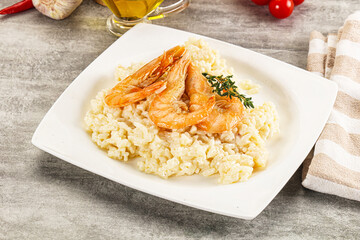 Italian risotto with prawn served thyme