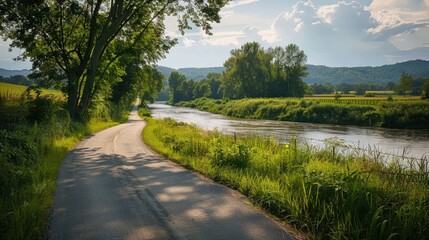 quiet country road that follows the edge of a serene river.