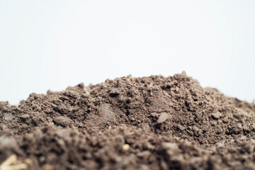 Close Up Of Moist Brown Fresh Soil on a White Background.