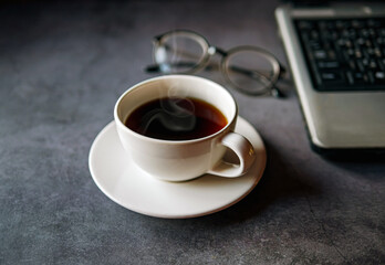 Relax during business work concept, americano coffee cup and black coffee cup aromatic and laptop computer in morning