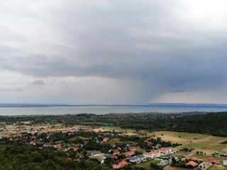 Lake Balaton panorama from bird's eye view from a look-out tower in Balatongyorok, Hungary with vilagge houses and fields