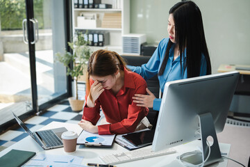 Stress businesswoman is sitting at table, under stress from working.