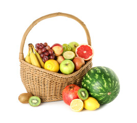 Many different fresh fruits in wicker basket isolated on white