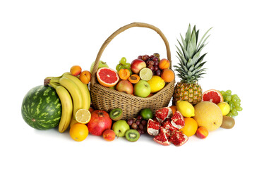 Many different fresh fruits in wicker basket isolated on white