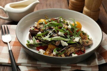 Tasty salad with grilled vegetables served on table, closeup