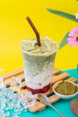 Matcha green tea, strawberries and flavored milk, blended into a drink.