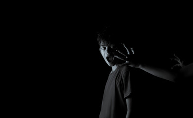 Creative image of a boy in the dark