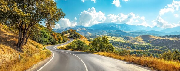 Winding road through mountain landscape on a sunny day