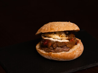 Cheese burger with bacon and egg on black background	
