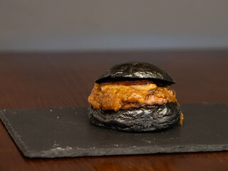 Cheese burger with bacon and egg on black background	
