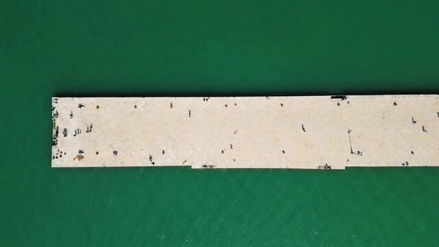 aerial view people walking on the wharf, molo audace, trieste, italy