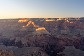 A stunning sunset view of the red rocks at Grand Canyon National Park, Arizona.