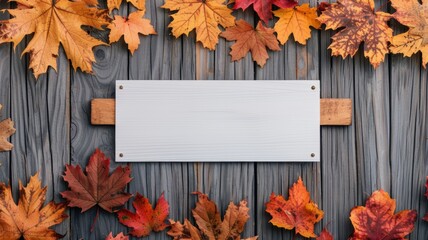 Obraz premium A rustic wooden background adorned with vibrant autumn leaves, featuring a blank sign for customizable text or messages.
