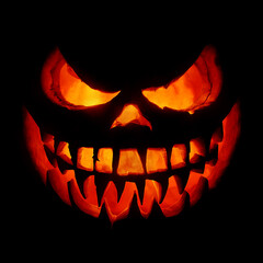 Fototapeta premium Darkness Looms Behind A Carved Pumpkin's Eerie Smile