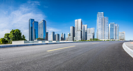 Obraz premium Asphalt highway road and city skyline with modern buildings scenery in Shenzhen. car advertising background.