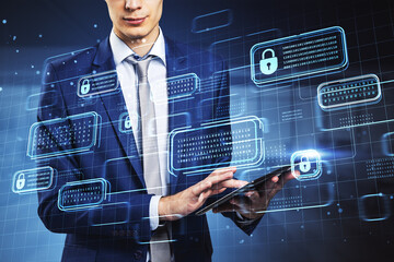 Headless young european businessman using pad with creative encrypted code hologram on blurry...