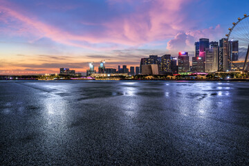 Asphalt road and modern city buildings scenery at night. car advertising background.