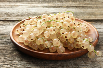 Fresh white currant berries on wooden table, closeup