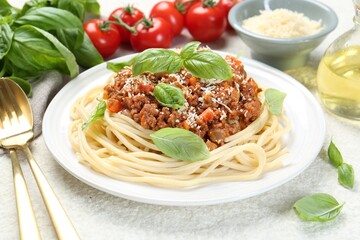 Tasty pasta bolognese served on white table, closeup