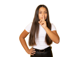 Portrait of beautiful and young brunette girl standing over transparent background asking to be quiet with finger on lips. Silence and secret concept.