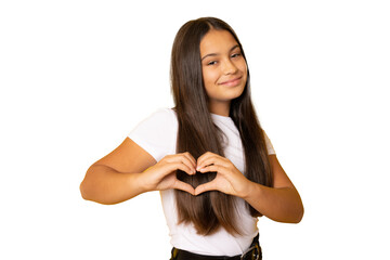 Fototapeta premium Adorable girl in white t-shirt making a heart gesture with her fingers with a happy sincere smile isolated over transparent background.