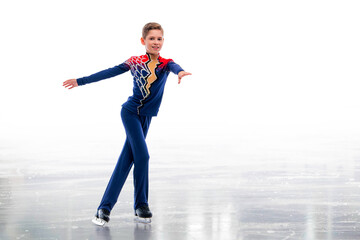 A boy ice skater in a Santa Claus hat is skating. © Maria Moroz