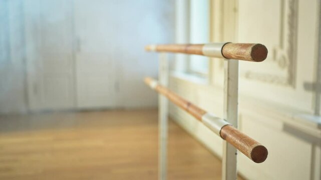 Empty ballet dance studio with barre. Professional ballet barre for stretching practicing dancing positions in dance school Dance hall ready for ballet class training. Ballet school