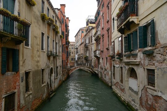 Serene Venetian canal flanked by historical buildings