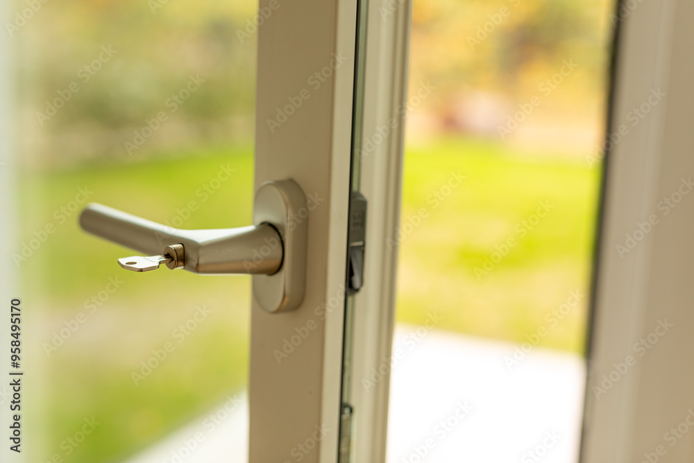 Poster close-up of a door handle with key