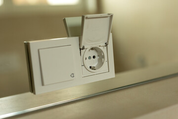 White Light Switch and Electrical Outlet on Mirror