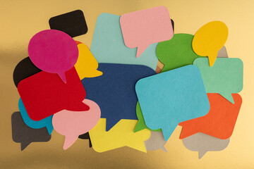 Colorful Speech Bubbles on Gold Background