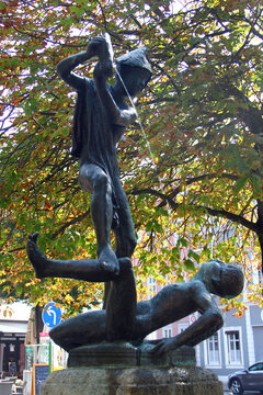 Erfurt, Germany - September 1, 2024: Raufende Knaben (Fighting boys), a bronze sculpture in the fountain on Wenigemarkt, or Small Market Square near the famous Kraemerbruecke bridge