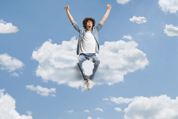 Guy cheering and sitting on a cloud